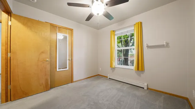 a view of empty room with wooden ceiling