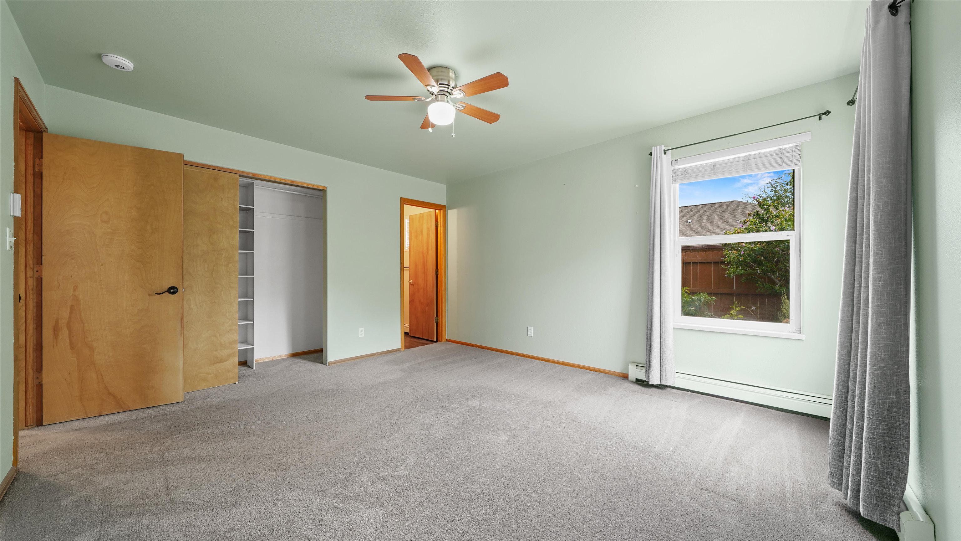 819 Elberta Avenue Palisade, CO 81526 - Photo 7 of 40 an empty room with closet and windows