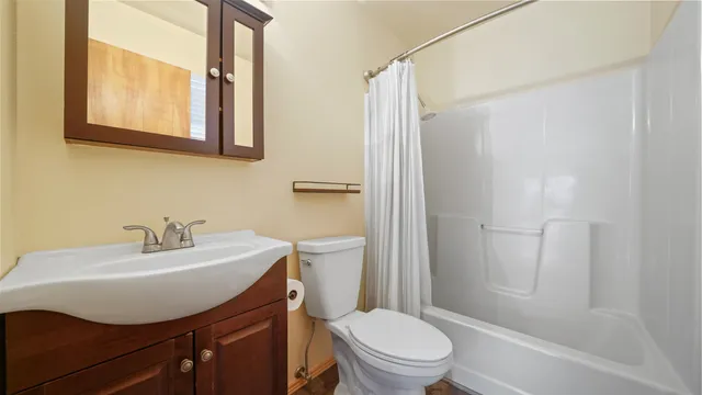 a view of a house with brick walls and plants