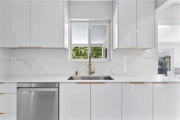 a bedroom with a large bed and a tv