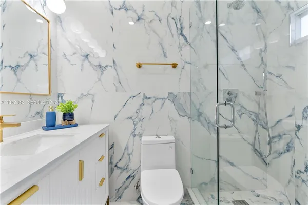 a bedroom with two beds and a large window