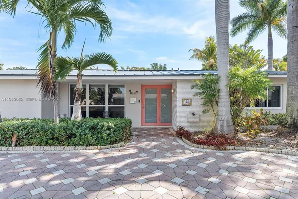 a living room with furniture large window and flat screen tv