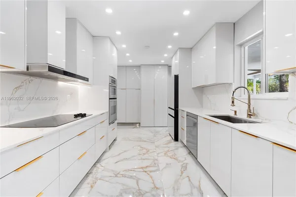 a living room with furniture and large windows