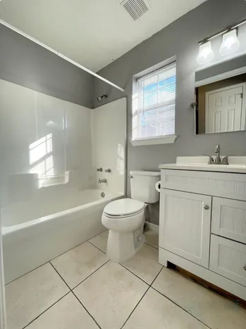 a bathroom with a sink a toilet and a bathtub