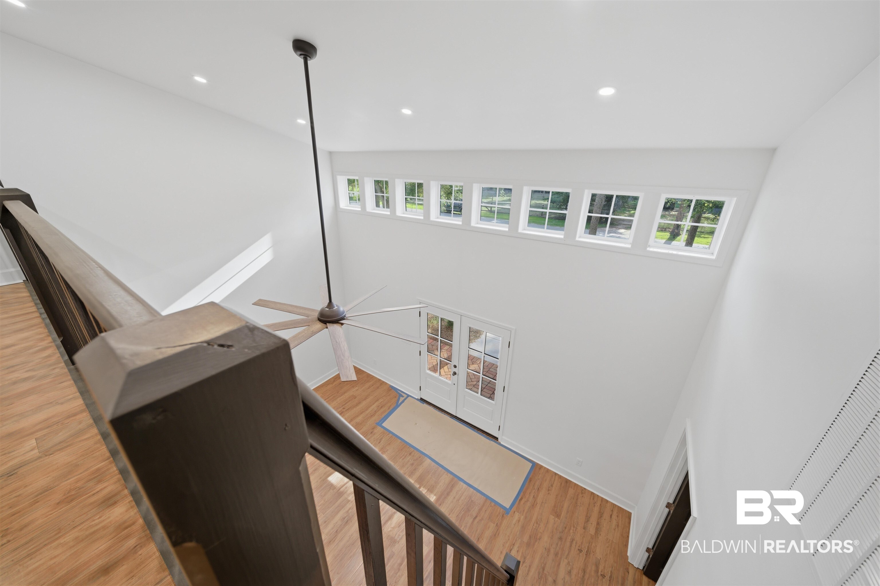 14128 Jackson Lane Foley, AL 36535 - Photo 32 of 36 Two-story foyer featuring wood-finish flooring, a ceiling fan, recessed lighting, a French door entry, and transom windows