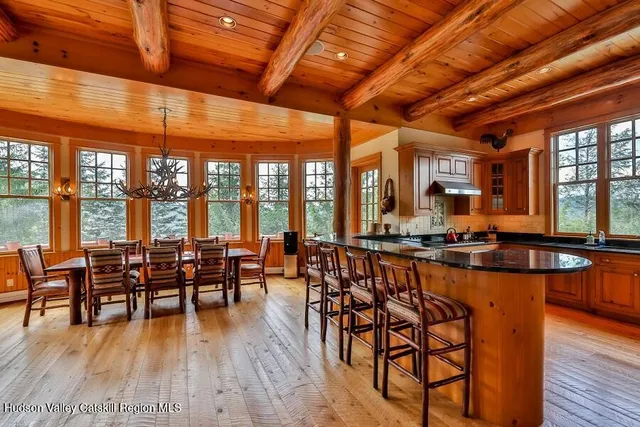 a bedroom with furniture and large window