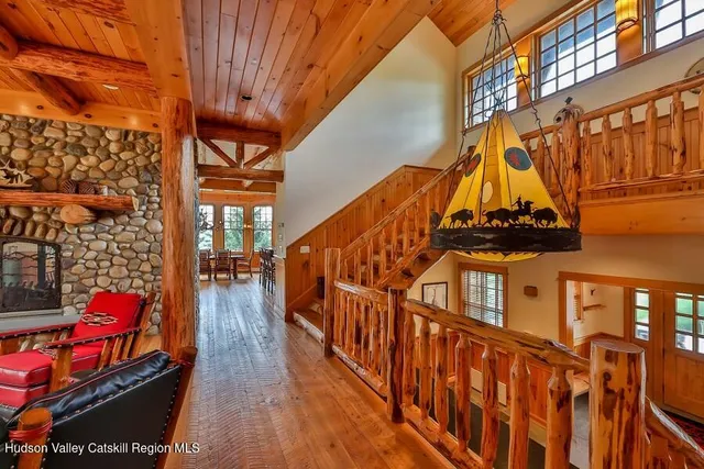 a bathroom with a granite countertop toilet sink and mirror