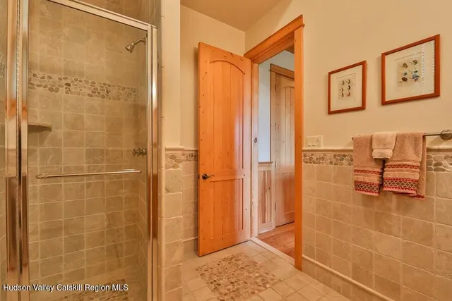 a view of a chairs and table in the balcony