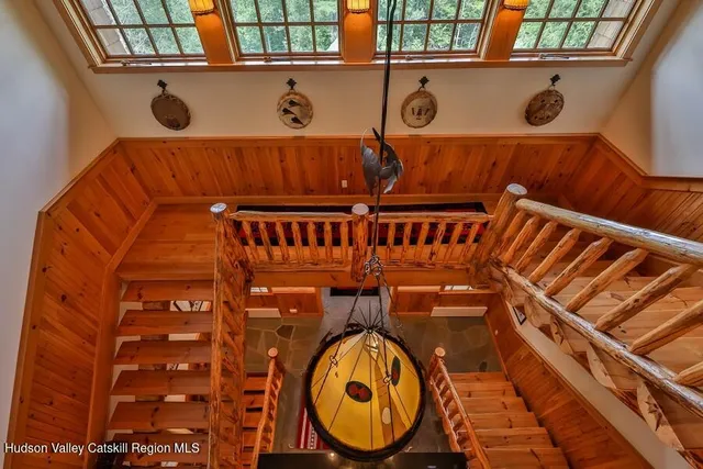 an aerial view of house with swimming pool and garden space