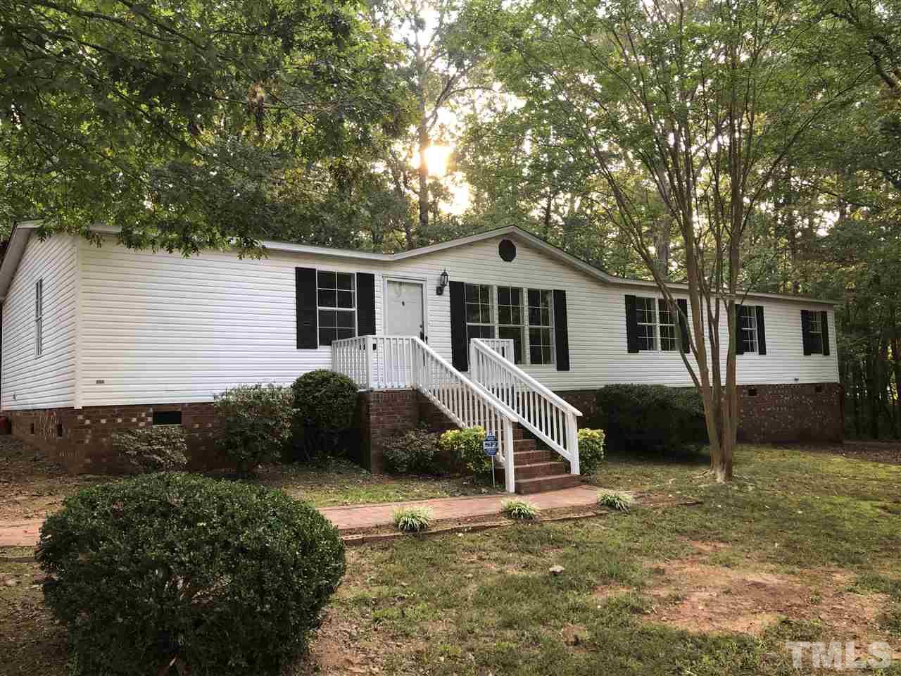1320 Yakimas Road Raleigh, NC 27603 - Photo 1 of 14 a view of a house with a yard