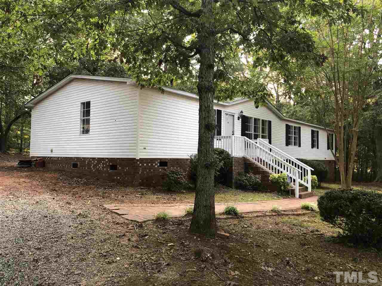 1320 Yakimas Road Raleigh, NC 27603 - Photo 14 of 14 a front view of a house with a yard