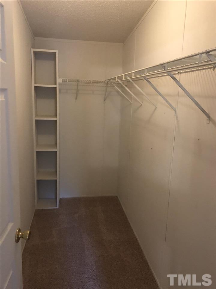 1320 Yakimas Road Raleigh, NC 27603 - Photo 8 of 14 a view of an empty walk in closet