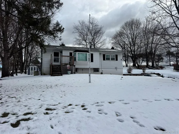 a view of a white house with a snow
