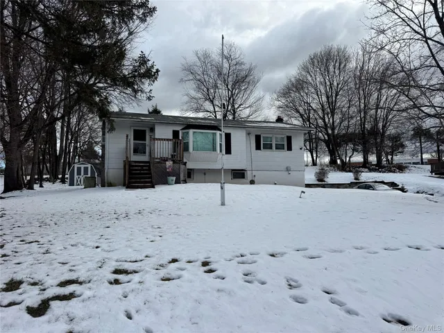 a view of a white house with a snow