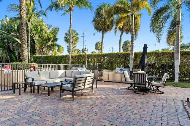 a view of a tables and chairs on the roof deck