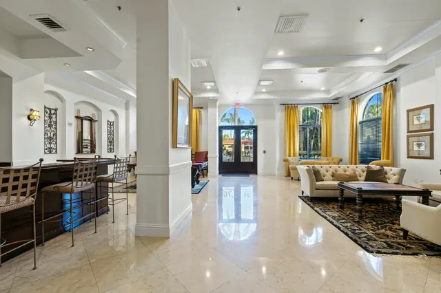 a lobby with furniture and wooden floor