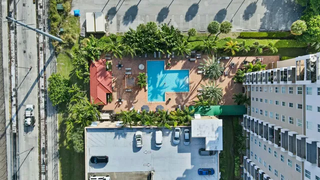 a view of a house with a flower garden
