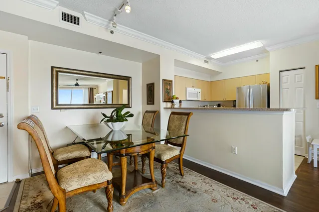 a view of a dining room with furniture and a window