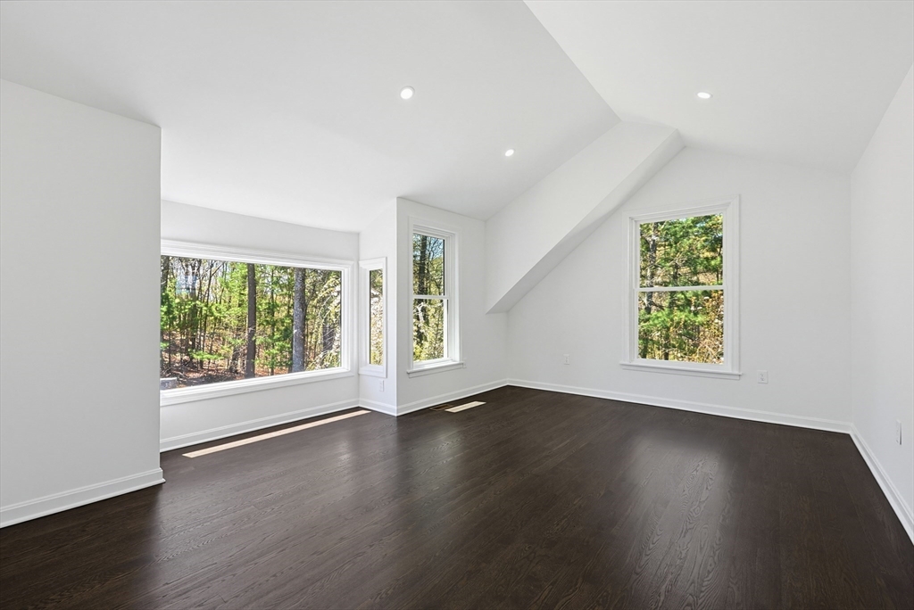 175 Pleasant Street Upton, MA 01568 - Photo 28 of 39 a view of an empty room with wooden floor and a window