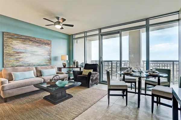 a living room with furniture and a large window