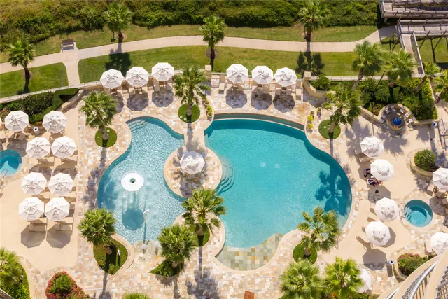 a bathroom with a toilet sink and shower