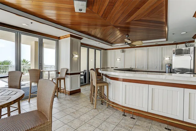a living room with furniture a rug and a table