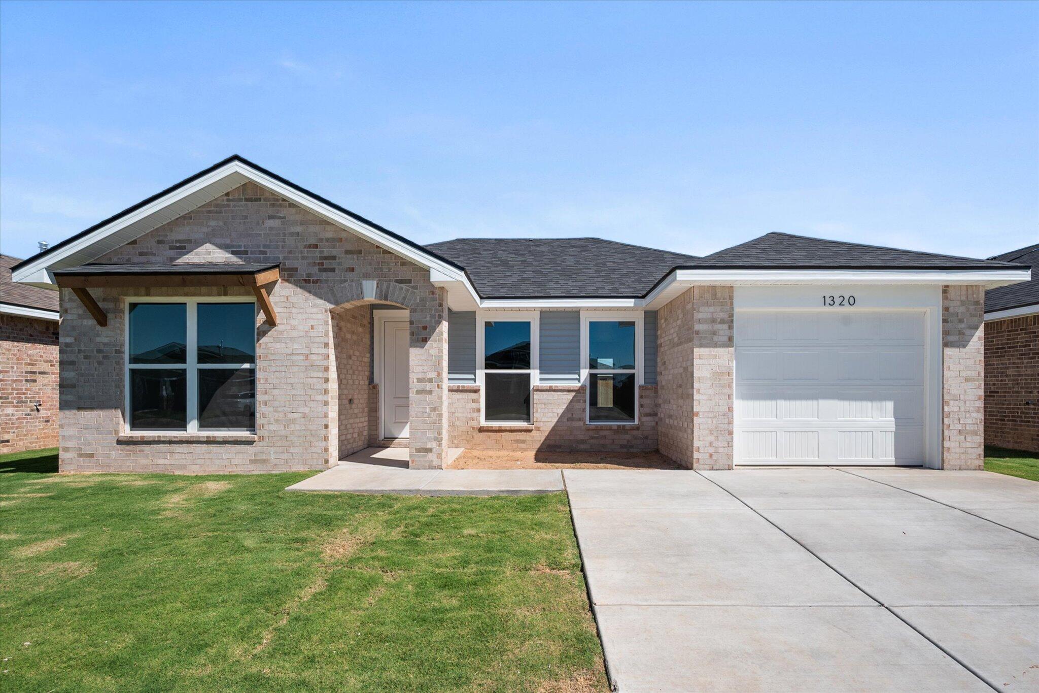 1320 North Colton Avenue Lubbock, TX 79416 - Photo 1 of 22 a front view of a house with a yard and porch