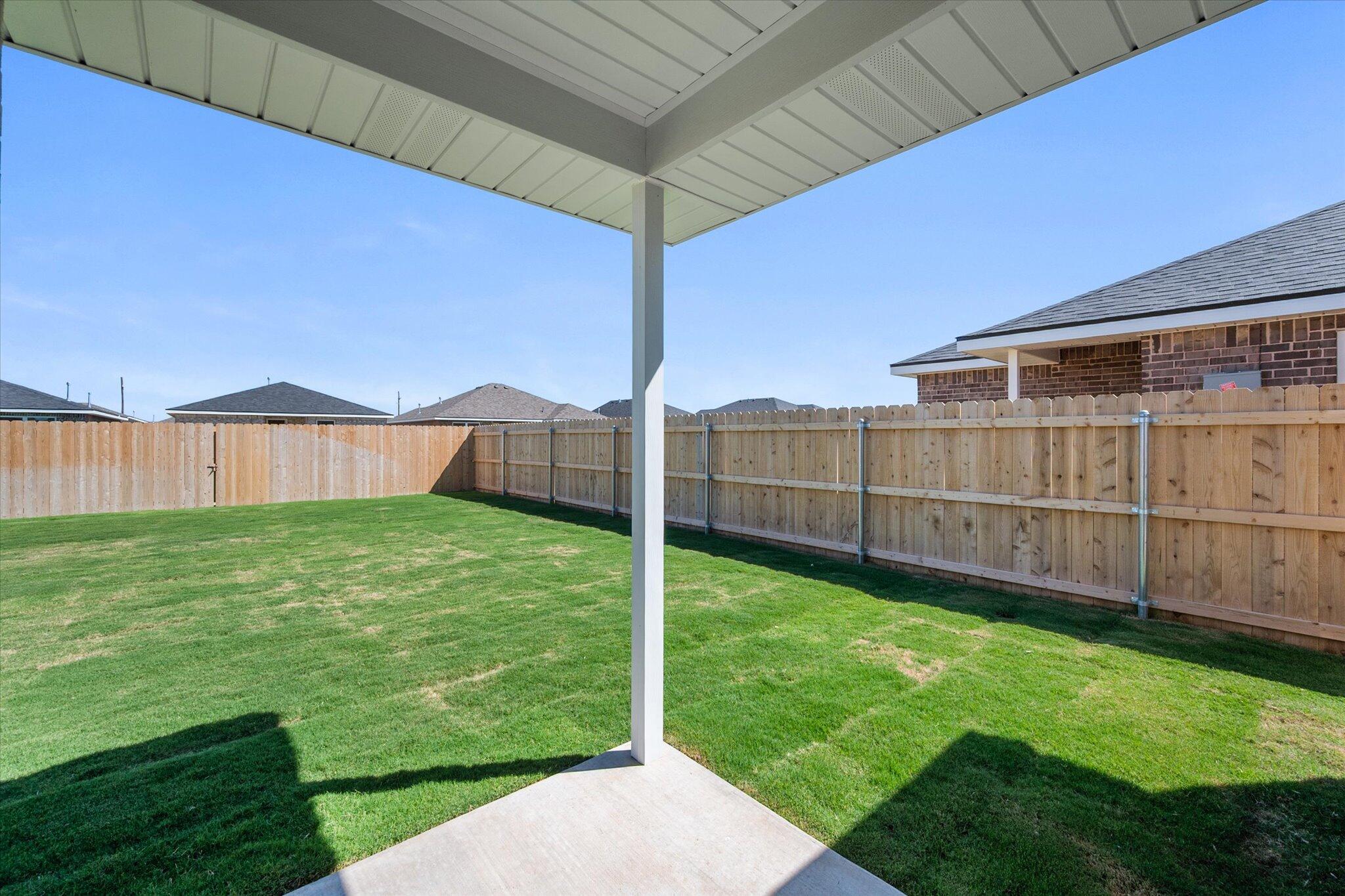 1320 North Colton Avenue Lubbock, TX 79416 - Photo 14 of 22 a view of a backyard with wooden fence
