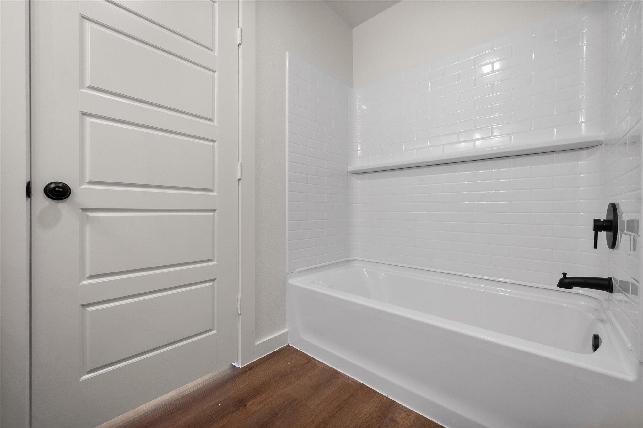 1320 North Colton Avenue Lubbock, TX 79416 - Photo 16 of 22 a bathroom with a bathtub