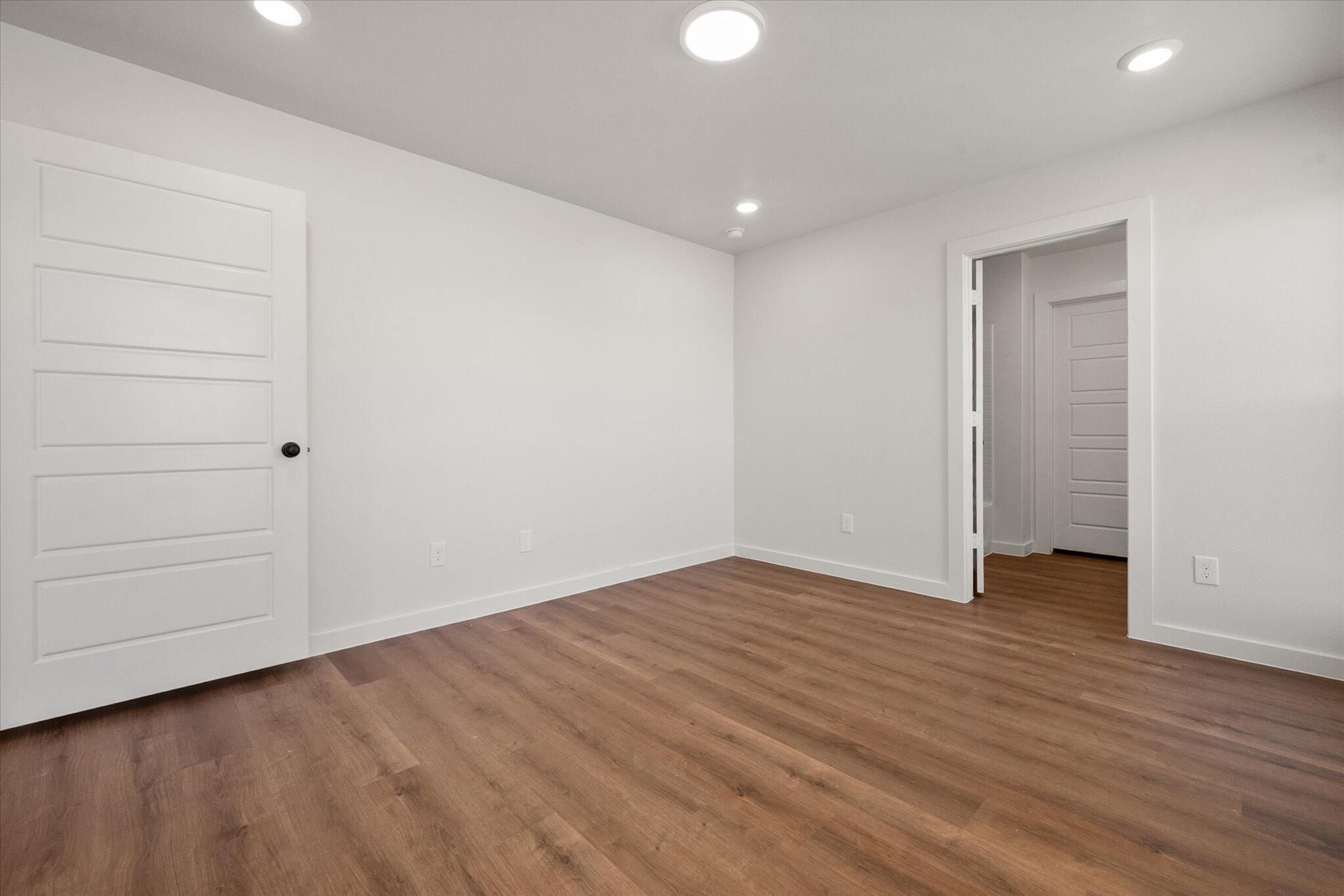 1320 North Colton Avenue Lubbock, TX 79416 - Photo 19 of 22 a view of an empty room with wooden floor