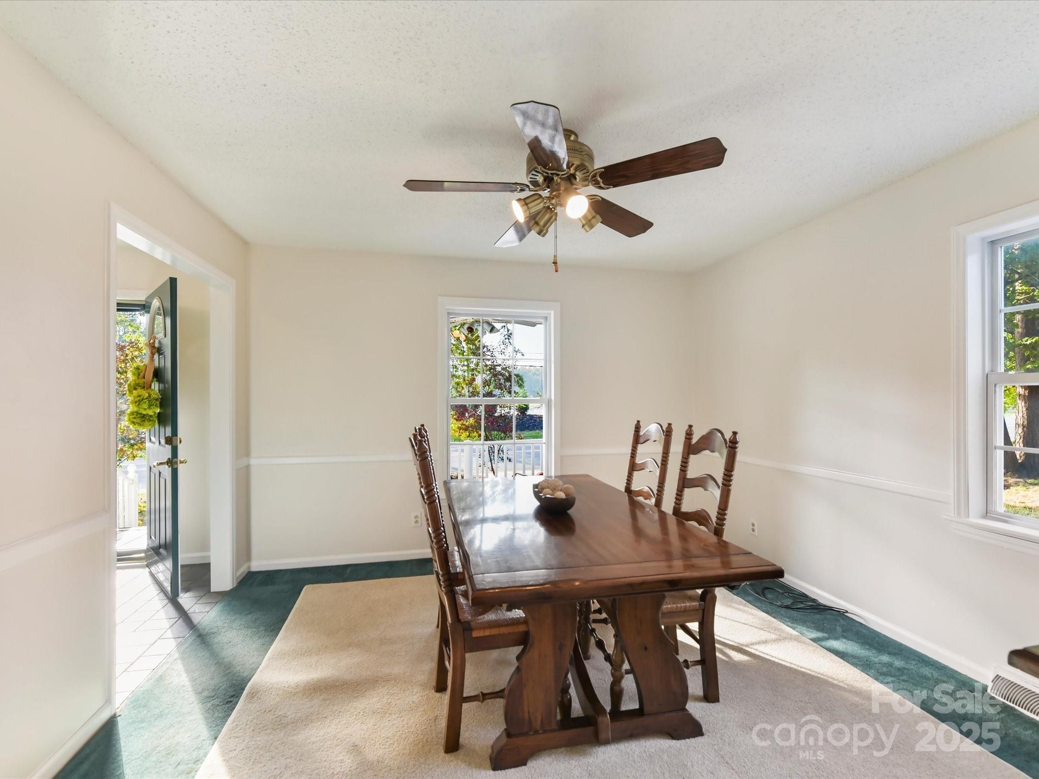 6313 Mill Grove Road Indian Trail, NC 28079 - Photo 11 of 47 a view of a dining room with furniture