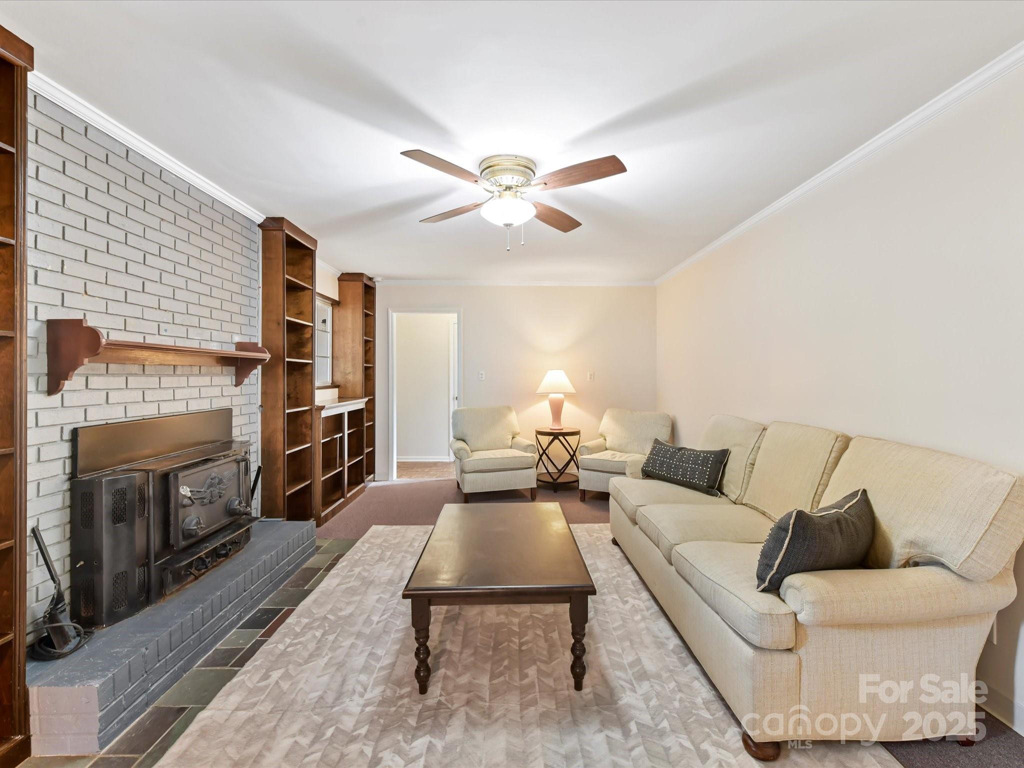 6313 Mill Grove Road Indian Trail, NC 28079 - Photo 14 of 47 a living room with furniture fireplace and a flat screen tv
