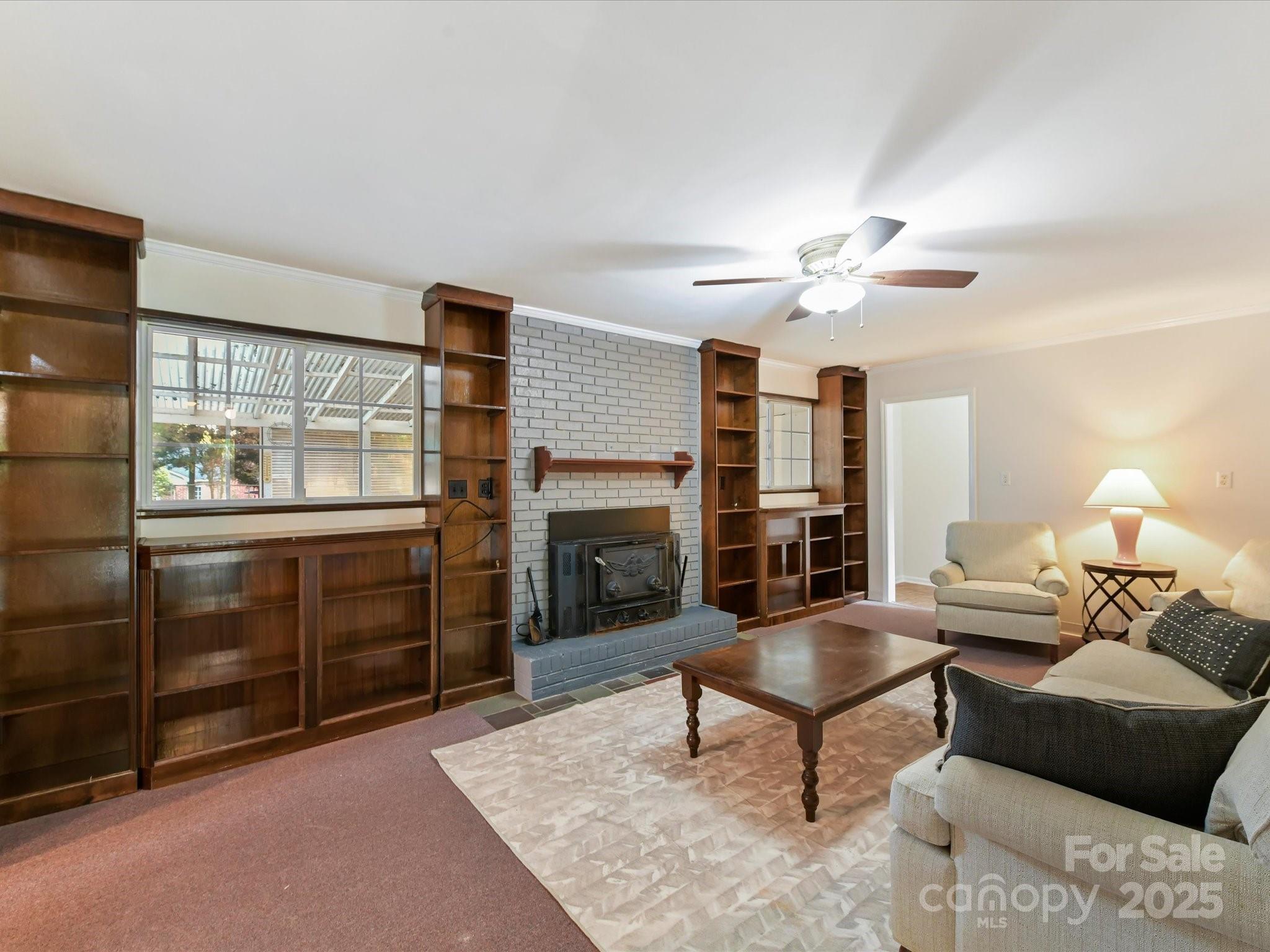 6313 Mill Grove Road Indian Trail, NC 28079 - Photo 15 of 47 a living room with furniture a fireplace and a flat screen tv