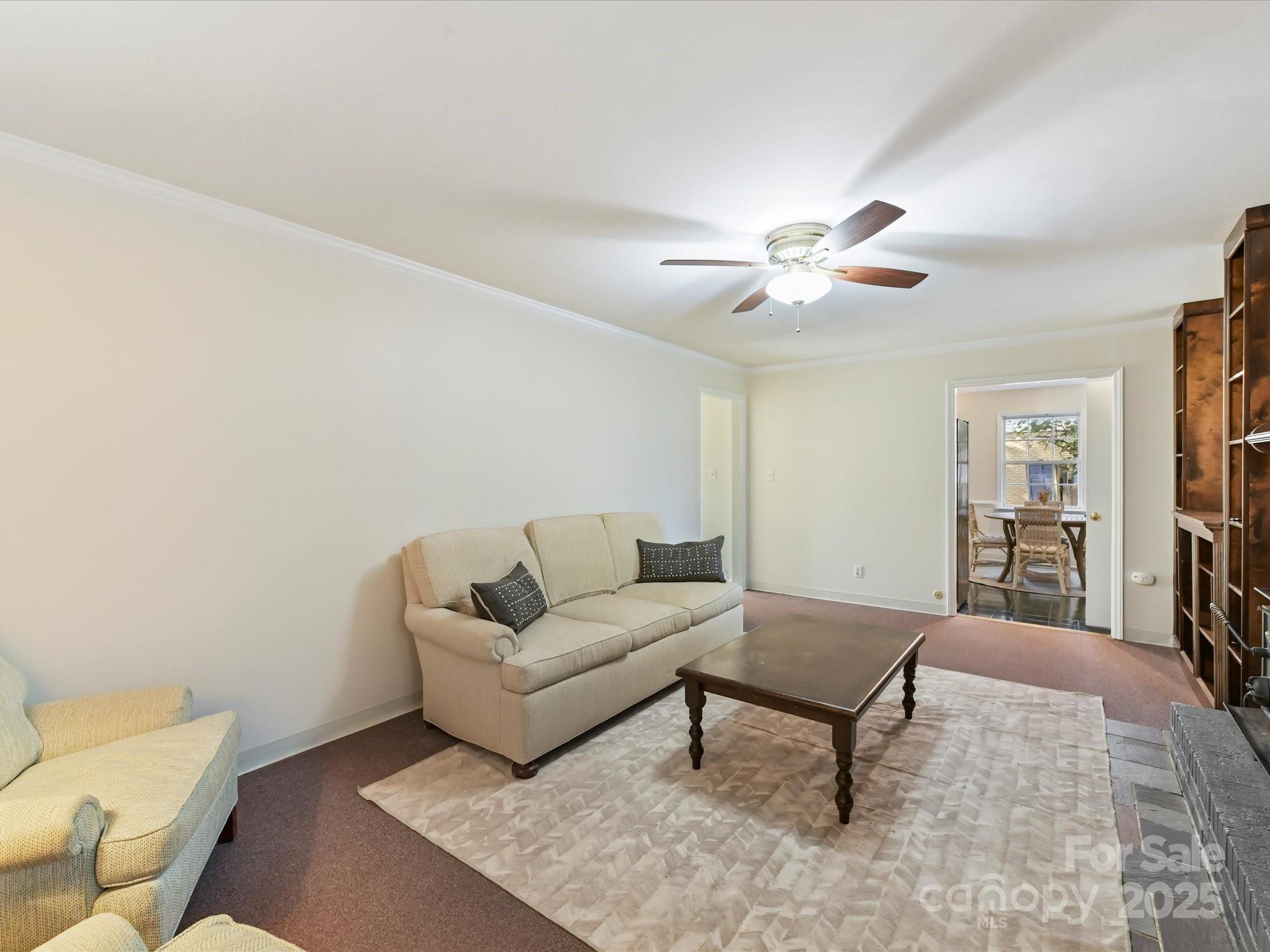 6313 Mill Grove Road Indian Trail, NC 28079 - Photo 16 of 47 a living room with furniture and a chandelier
