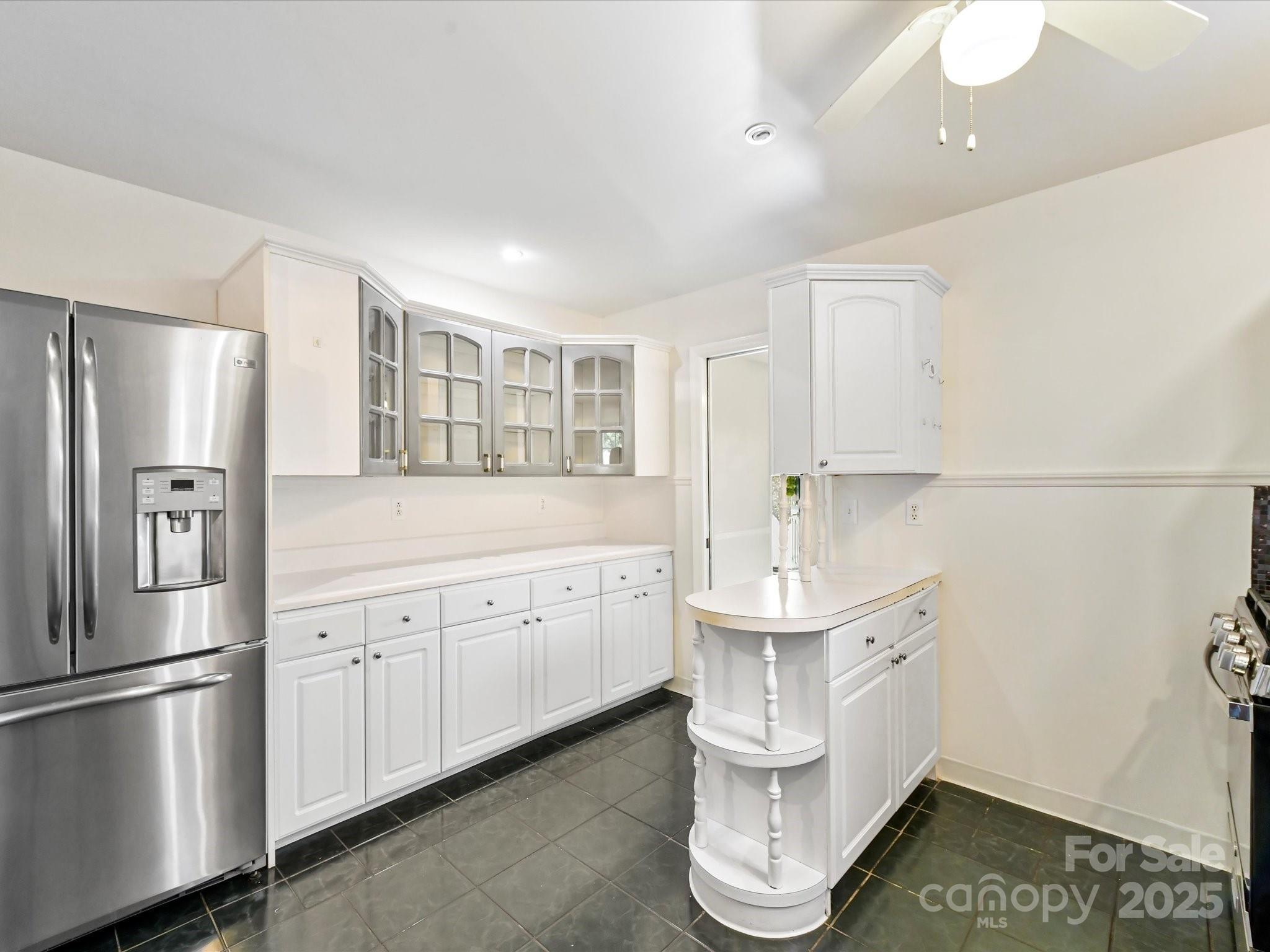 6313 Mill Grove Road Indian Trail, NC 28079 - Photo 20 of 47 a kitchen with stainless steel appliances a sink stove and refrigerator