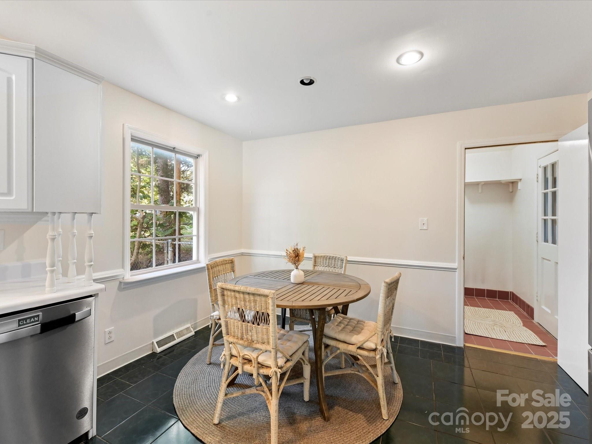 6313 Mill Grove Road Indian Trail, NC 28079 - Photo 23 of 47 a view of a dining room with furniture and wooden floor