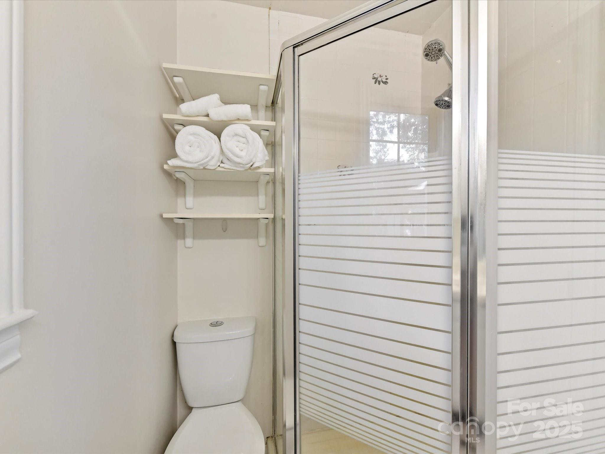6313 Mill Grove Road Indian Trail, NC 28079 - Photo 29 of 47 a bathroom with a toilet sink and shower