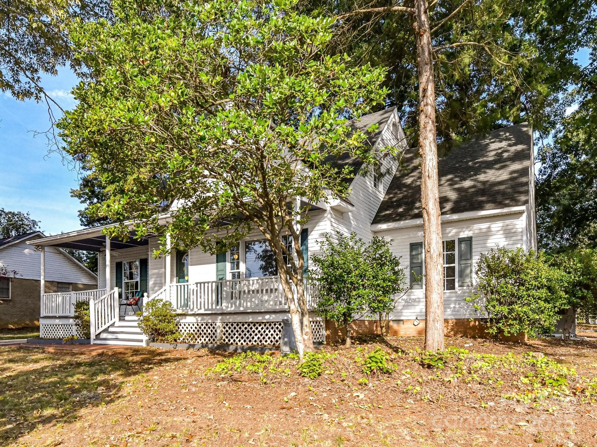 6313 Mill Grove Road Indian Trail, NC 28079 - Photo 3 of 47 a house with trees in front of it