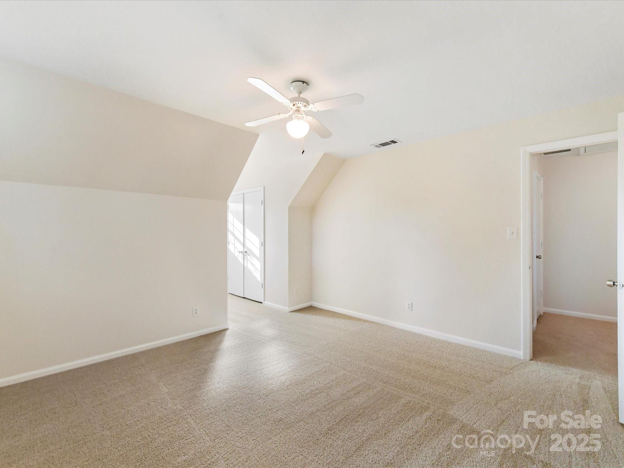 6313 Mill Grove Road Indian Trail, NC 28079 - Photo 37 of 47 a view of an empty room with a ceiling fan and window