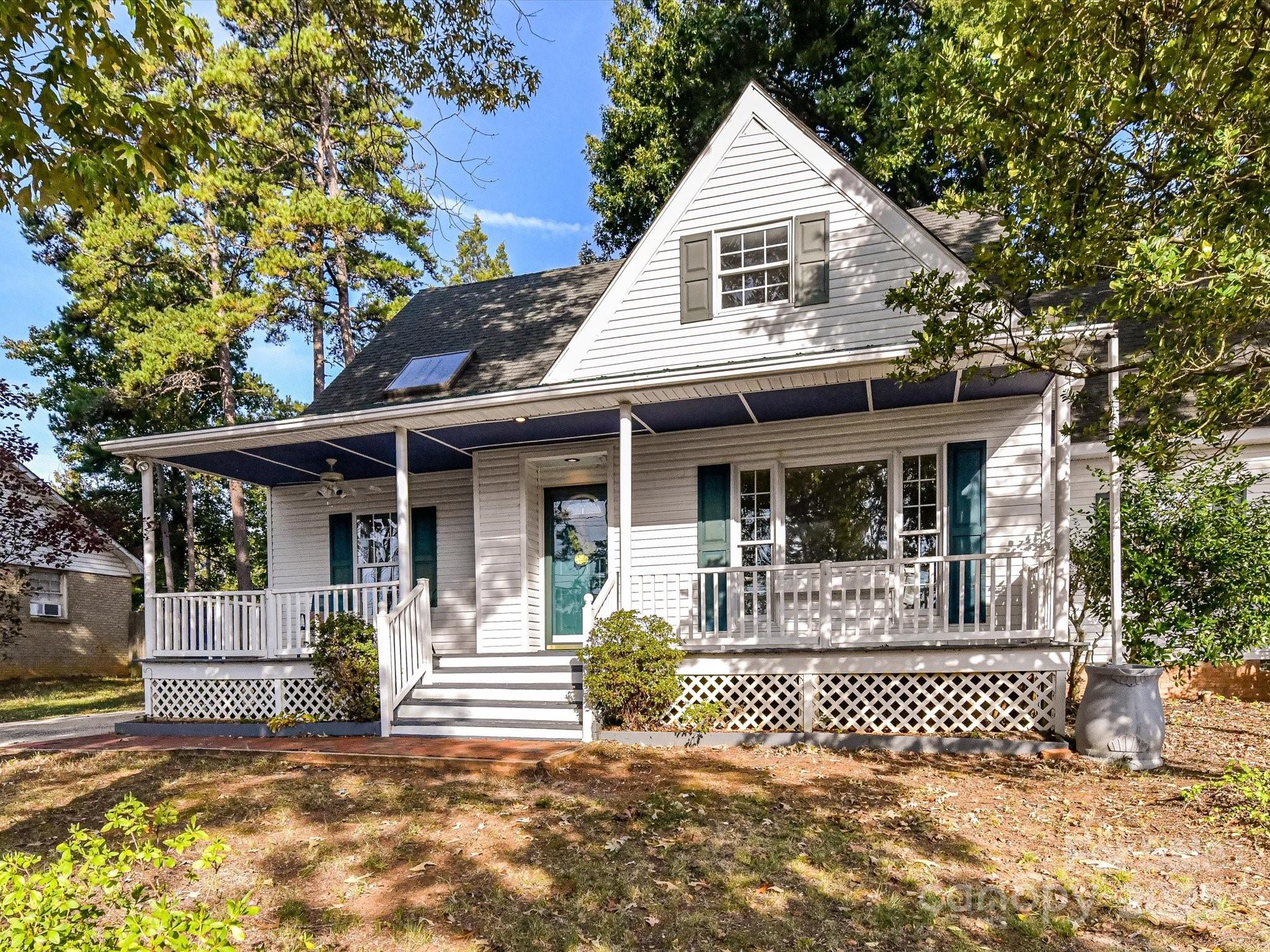 6313 Mill Grove Road Indian Trail, NC 28079 - Photo 4 of 47 a front view of a house with a garden