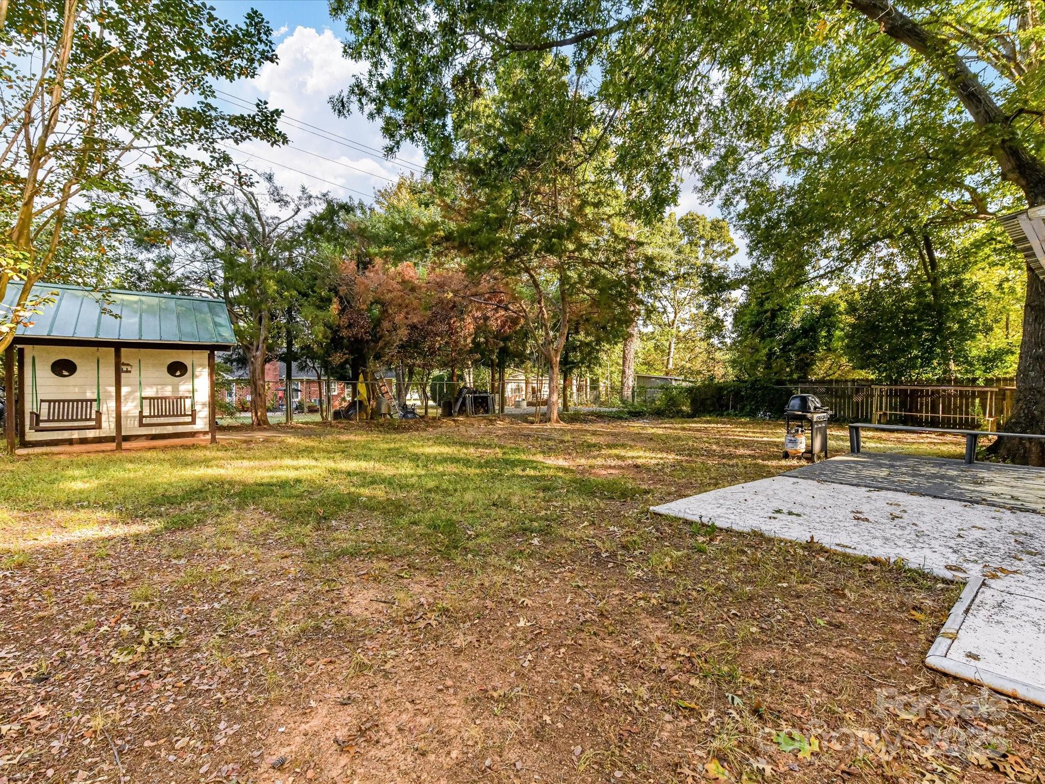 6313 Mill Grove Road Indian Trail, NC 28079 - Photo 46 of 47 a swimming pool with outdoor seating and yard