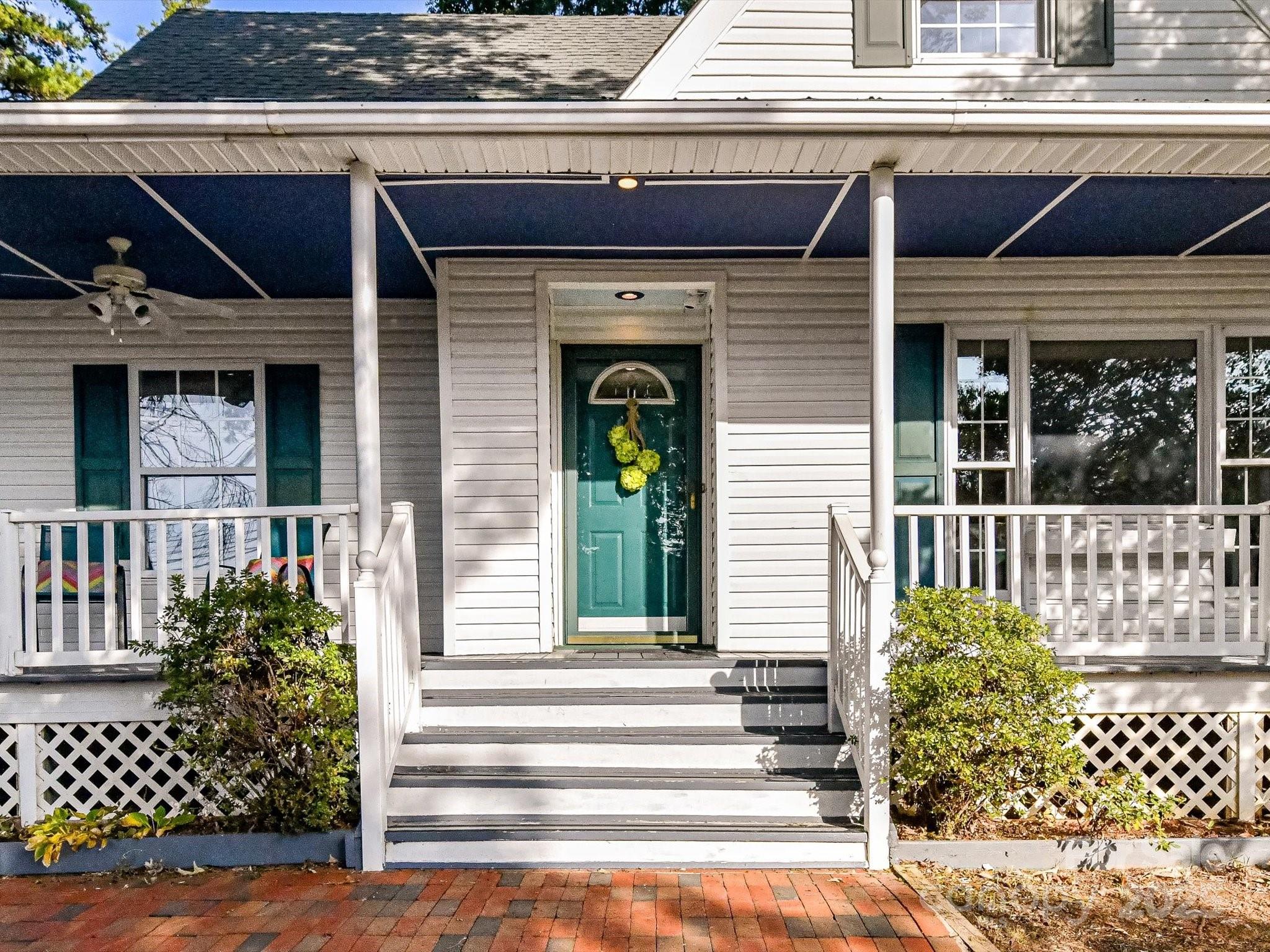 6313 Mill Grove Road Indian Trail, NC 28079 - Photo 5 of 47 a front view of a house with a garden