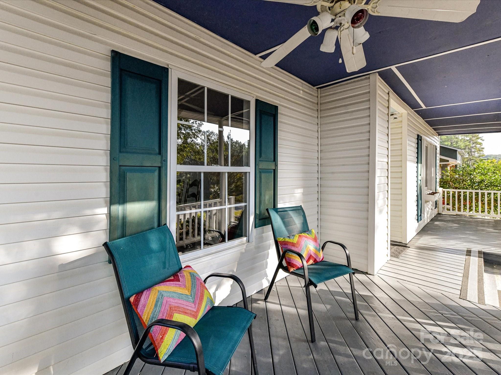 6313 Mill Grove Road Indian Trail, NC 28079 - Photo 7 of 47 a balcony with furniture and wooden floor