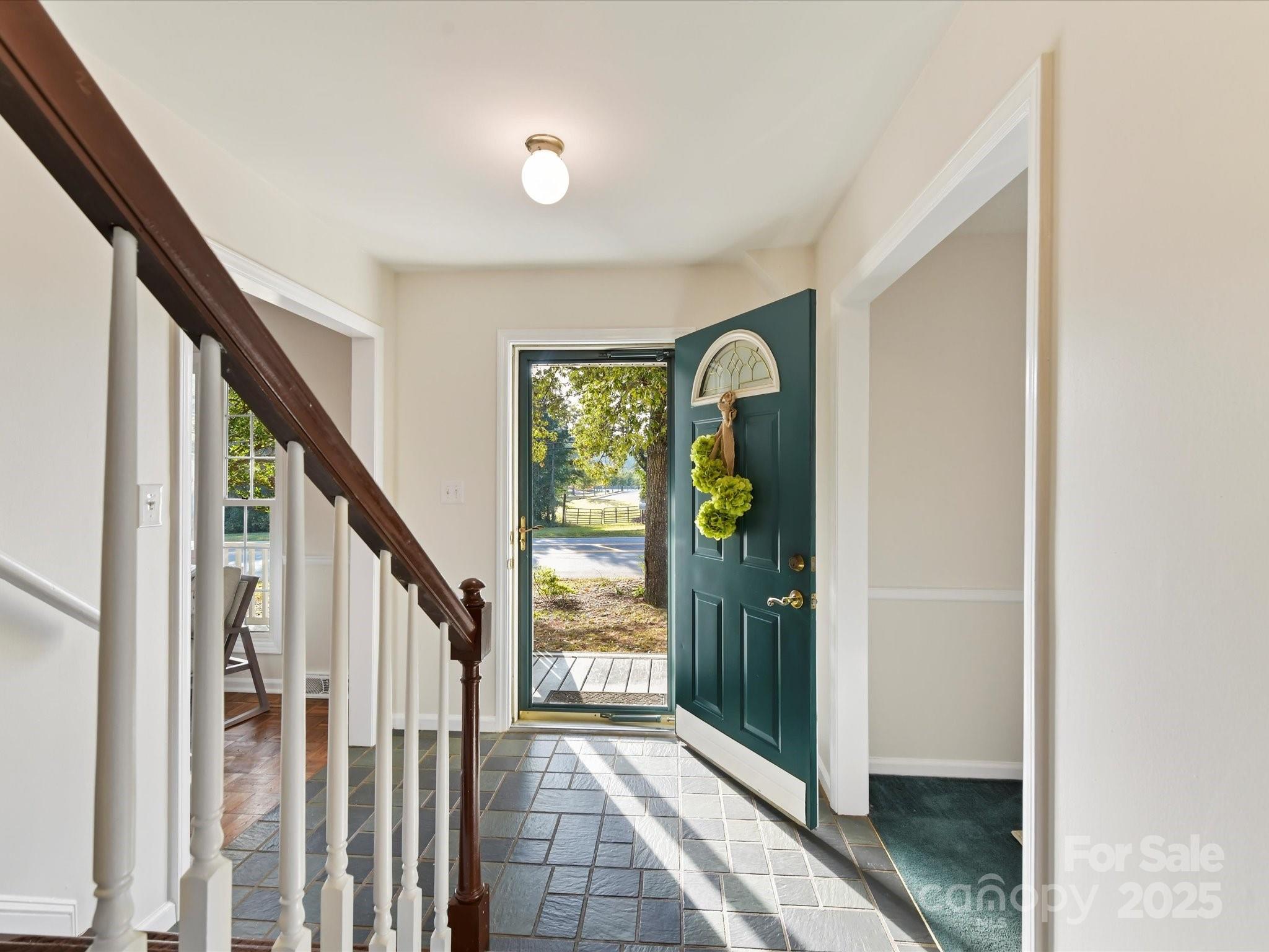 6313 Mill Grove Road Indian Trail, NC 28079 - Photo 9 of 47 a view of an entryway with wooden floor and windows
