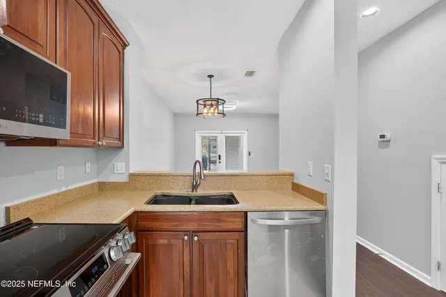 a white refrigerator freezer sitting inside of a kitchen