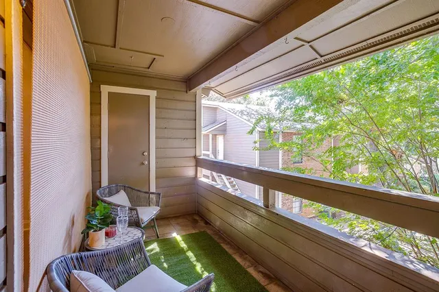 a view of a backyard with sitting area