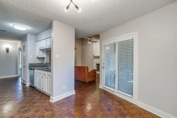 a view of a hallway with the bedroom and a window