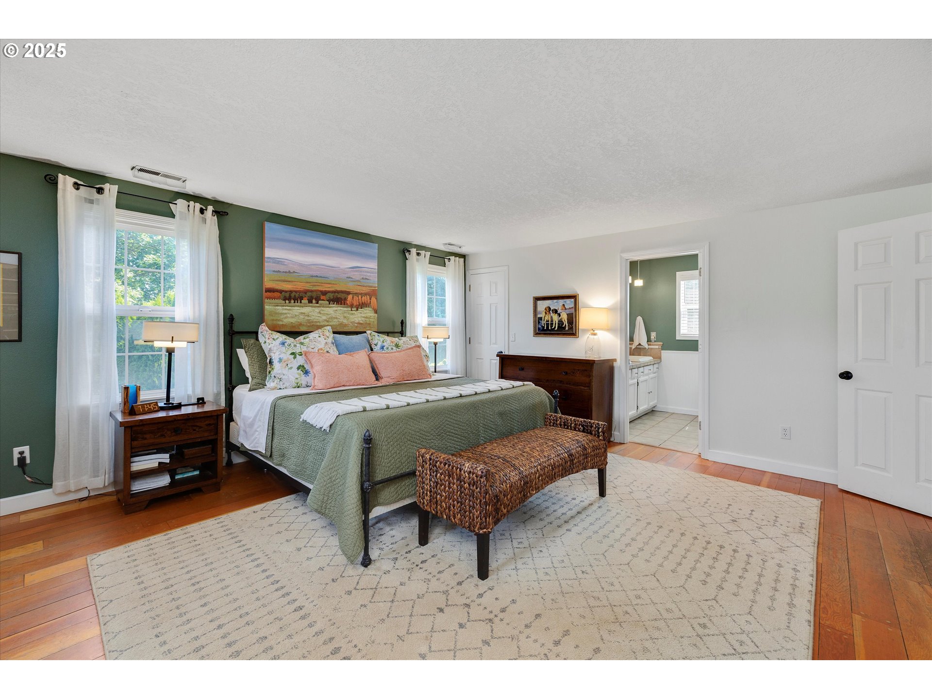 11800 South Carus Road Canby, OR 97013 - Photo 17 of 45 a bedroom with a bed a table and chair