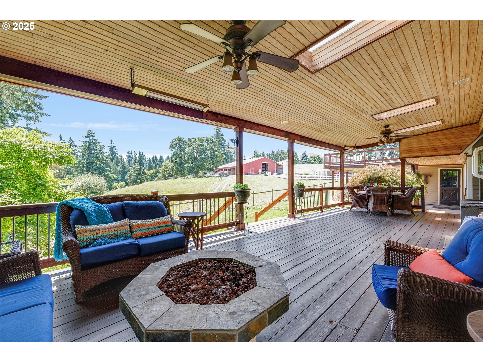 11800 South Carus Road Canby, OR 97013 - Photo 27 of 45 a living room with furniture a rug and a floor to ceiling window
