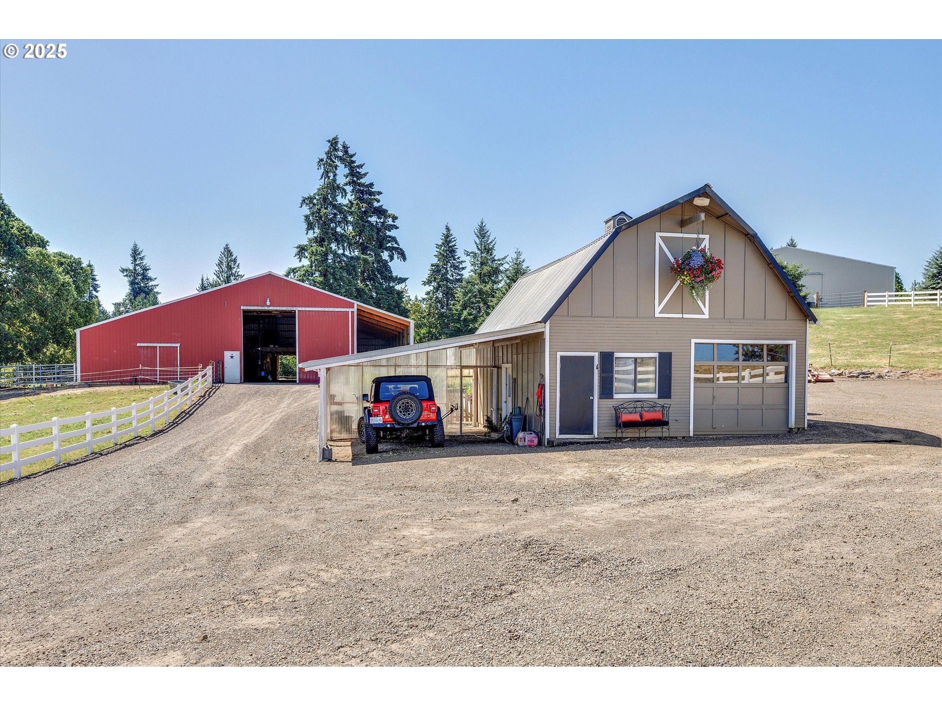 11800 South Carus Road Canby, OR 97013 - Photo 30 of 45 a front view of a house with a yard and garage